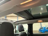 a view of the inside of a car with the sunroof