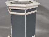 a white and gray pedestal with a glass top
