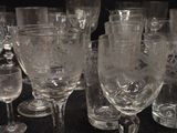 a lot of wine glasses sitting on a table