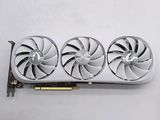 three fan blades on top of a white surface next to a pair of scissors