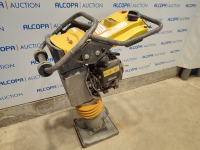 an image of a small machine that is sitting on a stand