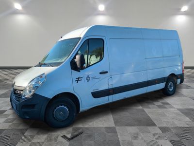 a picture of a blue van parked on a checkered floor