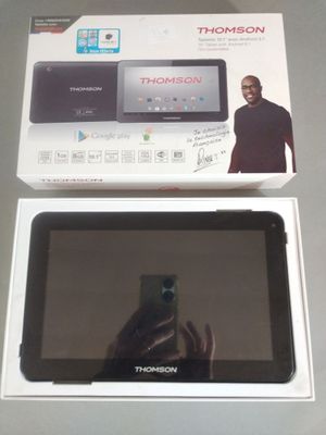 someone is taking a picture of a tablet in a box