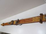 a wooden ski hanging on the wall in the room