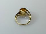 an image of a gold ring with a citrine stone in the center