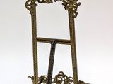 a gold frame with a mirror on it on a white background