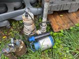 a water pump that is next to a bunch of crates