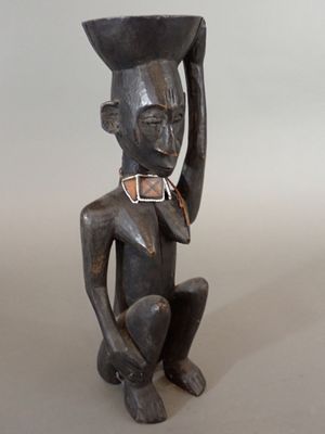 an image of a statue of a man with a hat on his head