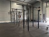 an image of a gym area with a crossfit station