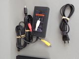 a remote control and a charger sitting on a table