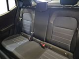 two seats in the back of a car that are black