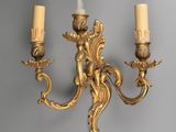 an image of a pair of wall sconces on a gray wall