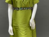 an image of a mannequin dressed in a green dress