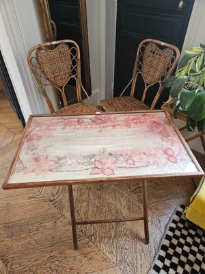 two chairs and a table in the corner of a room