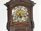 a clock on the wall with roman numerals on it