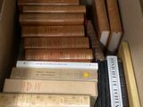 a box full of books that are sitting on a table