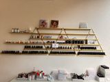 many bottles of nail polish on the shelves in the room