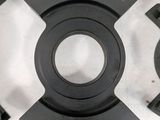 a picture of a set of black parts on a white surface