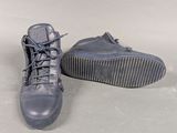 a pair of shoes that are on a white surface