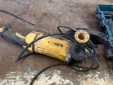a picture of a drill and other tools on a concrete floor