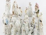 a lot of figurines that are sitting on a table