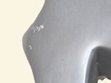 a close up of a metal object with a hole in it