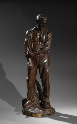 une image représentant une statue en bronze d'un homme tenant un chien