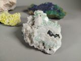 some very pretty colored rocks sitting on top of a table