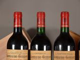 three bottles of wine are lined up in a row on a table