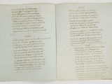 an open book with a handwritten poem on it sitting on top of a table