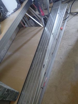 a picture of a metal shelf with a lot of tools on it