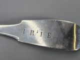 a close up of a spoon with the word true written on it