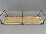 a bed that has a metal frame with barbed wire on it