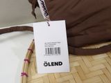 a brown bag with a label on it sitting on a table