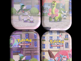 trois boîtes ornées de personnages Pokémon posées devant un immeuble