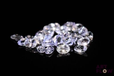 some very pretty white diamonds on a black surface