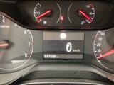 a close up of a car dashboard with a speedometer and gauges