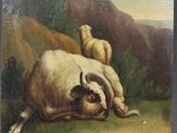 une image représentant une vache couchée dans un champ