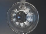 a glass ornament with a blue eye inside of it
