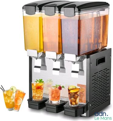 four drinks being served in a dispenser on a table