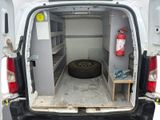 a white van with a tire in the back of it