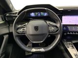 the interior of a car with a steering wheel, dashboard, and display screen