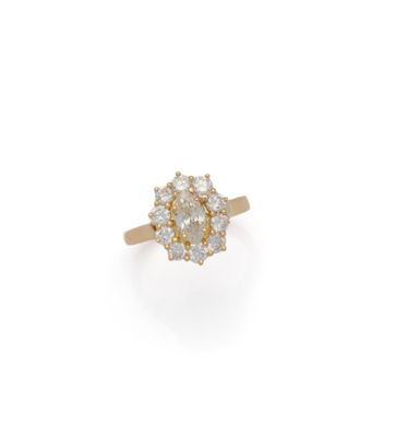 an 18k yellow gold diamond cluster ring