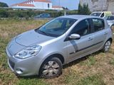 a silver car that is parked in the grass