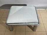 a small table with a mirror on top of it