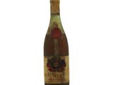 a bottle of wine that is sitting on a table