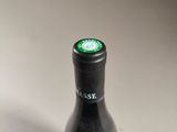 a bottle of wine that is sitting on a table