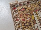 a rug on the floor with a cat laying on it