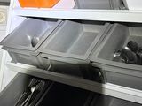 a stack of dishes and utensils in a kitchen