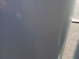 a close up view of the bottom of a white refrigerator